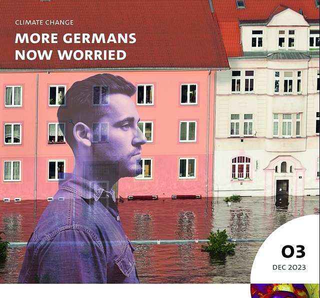 You can see the front of a building. It is surrounded by floodwater. The foreground shows the side profile of a man,he looks worried.